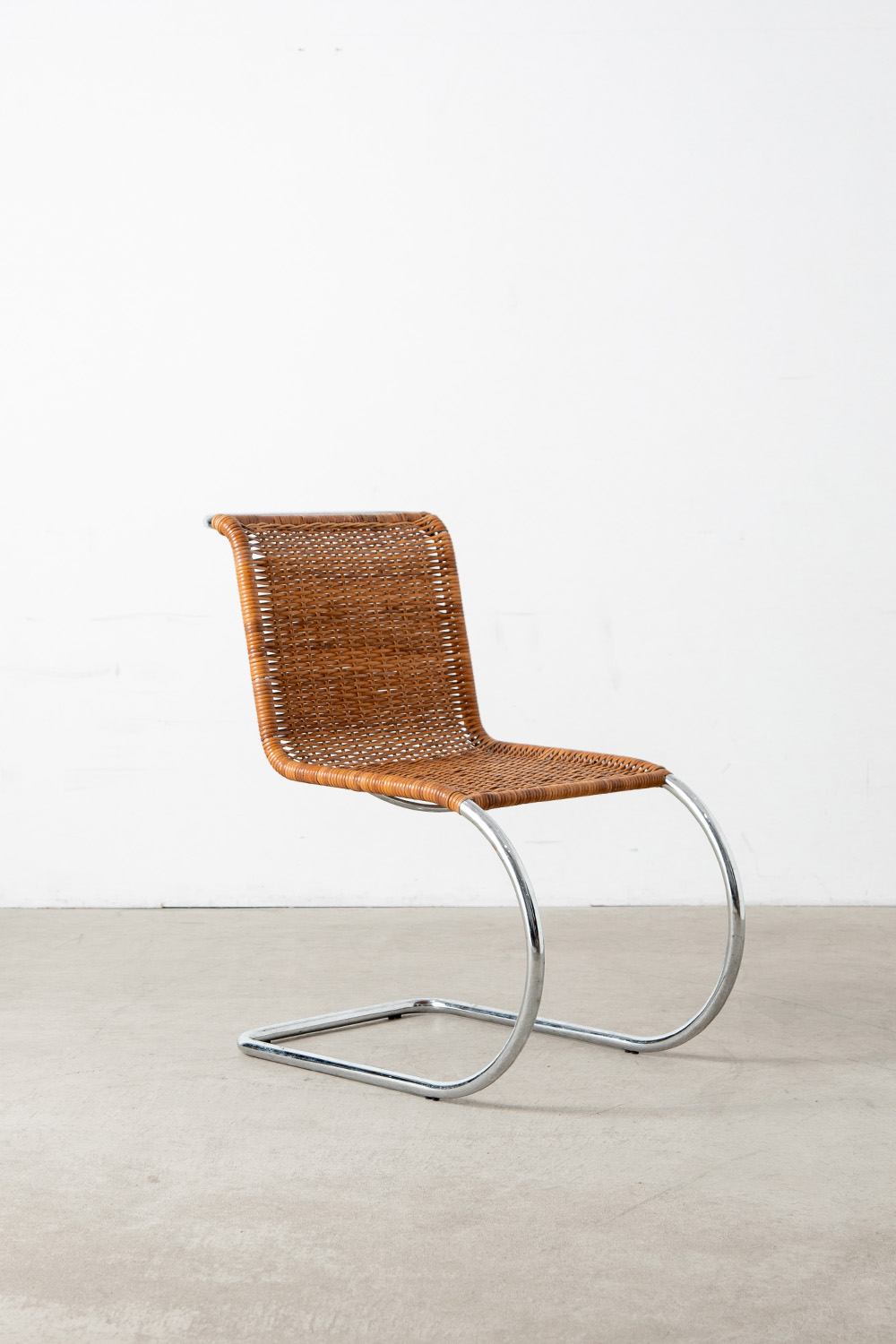 ‘MR10’ Chair by Mies van der Rohe in Chrome and Rattan