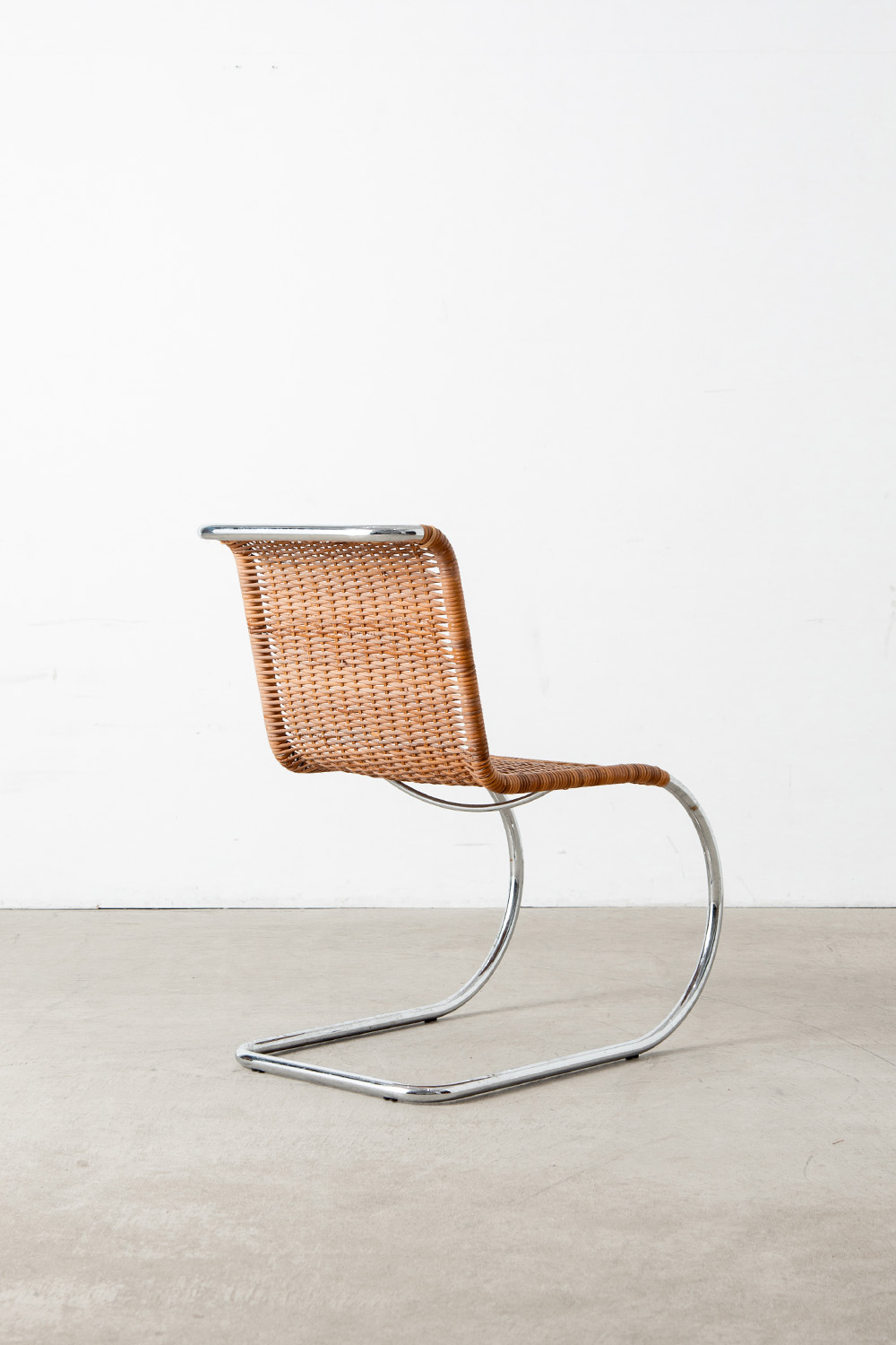 ‘MR10’ Chair by Mies van der Rohe in Chrome and Rattan