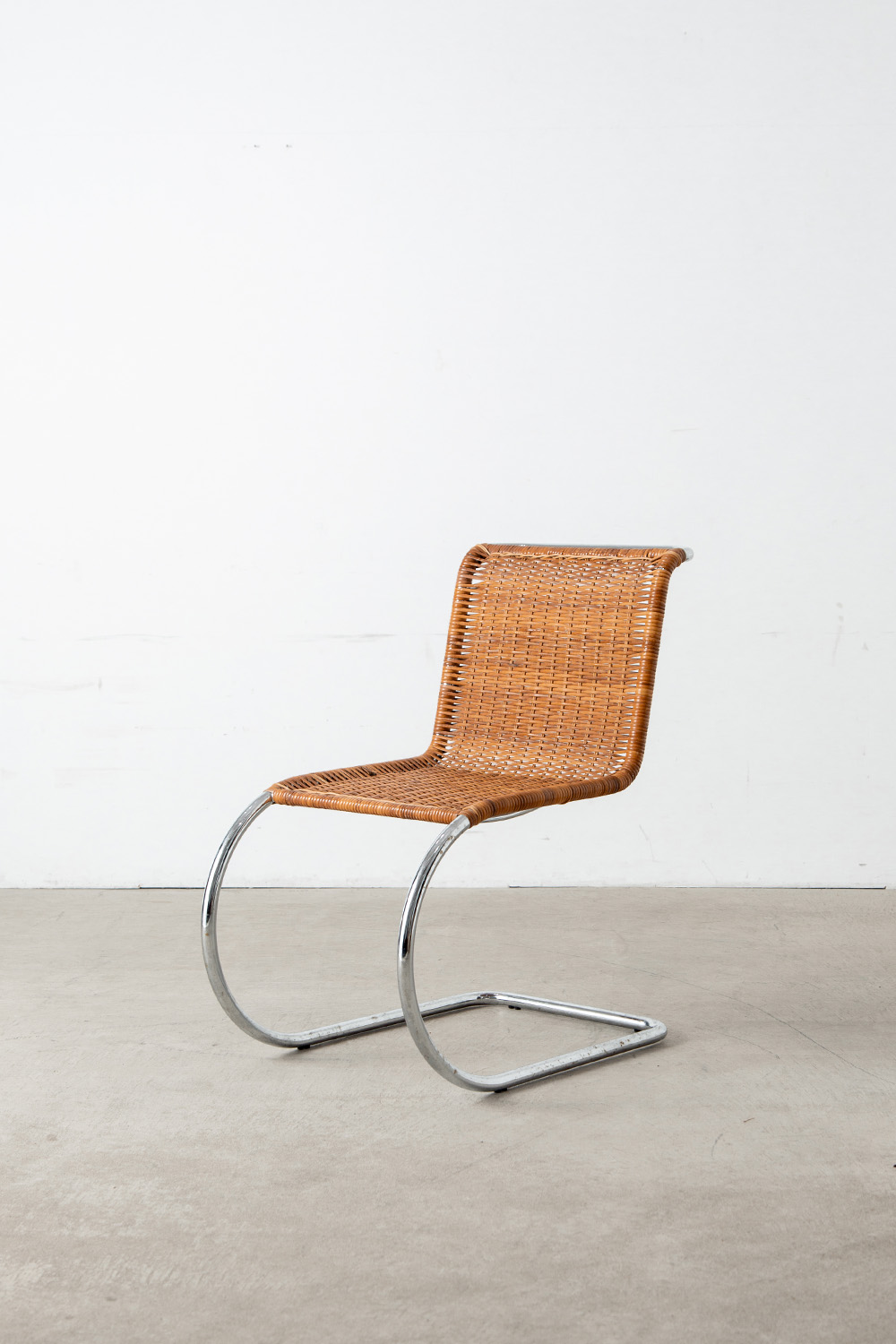 ‘MR10’ Chair by Mies van der Rohe in Chrome and Rattan