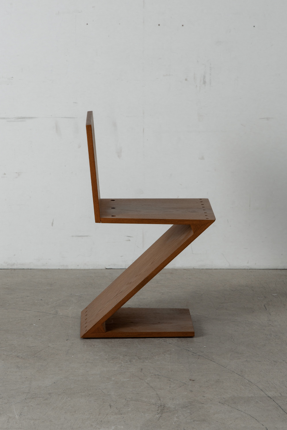 Zig Zag Chair by Gerrit Thomas Rietveld for METS & CO Edition in Wood and Brass